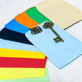 set of 10 colourful mini paper envelope pockets in mixed shades, shown open with small metal keys for scale