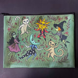 whimsical green blue zipper pouch featuring dancing cats, sun and moon characters, folk art inspired fairytale figures. witchy pencil case or journaling pouch. uk cute kawaii gifts shop.
