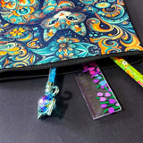 decorative folk art cat zipper canvas pouch featuring bright turquoise, navy and orange swirling floral patterns on a dark blue background. uk cute magical letterbox gifts shop. 