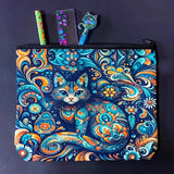 decorative folk art cat zipper canvas pouch featuring bright turquoise, navy and orange swirling floral patterns on a dark blue background. uk cute magical letterbox gifts shop. 