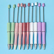 Set of colorful pen bases or blanks with pastel-coloured barrels on a blue background