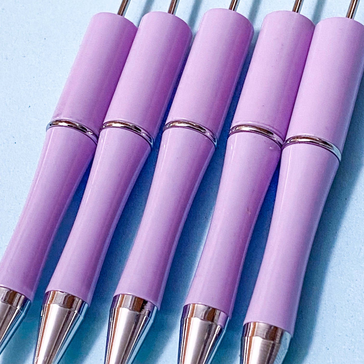 lilac soft pastel purple pen blanks on a blue background