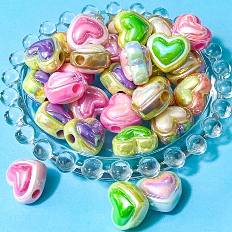 large 19mm acrylic pearly heart shaped beads with a large hole on a blue background
