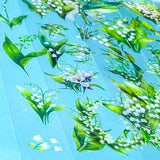 lily of the valley green and white flower stickers on a blue background
