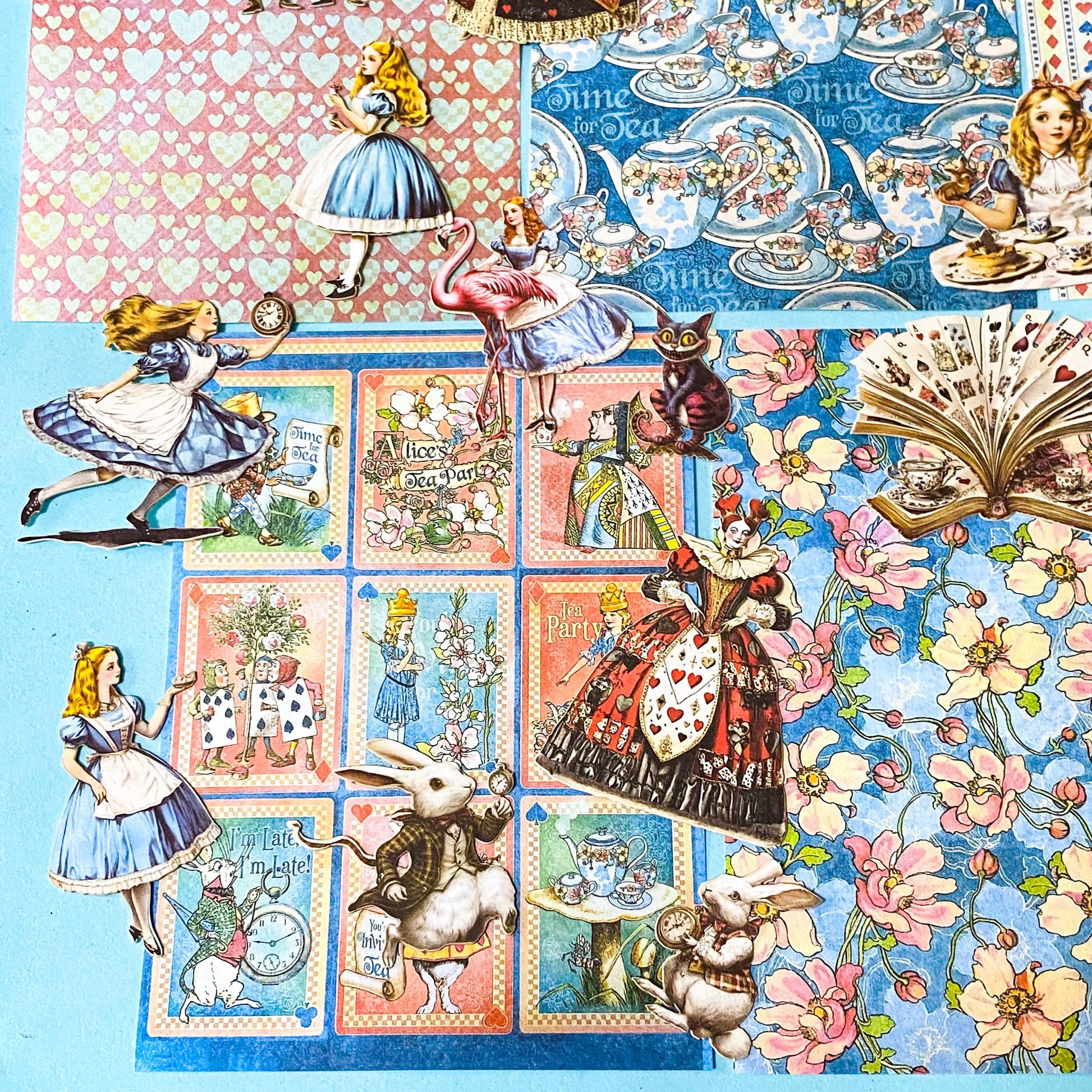 alice in wonderland ephemera sticker pack with scrapbook papers, die cut card stickers in a tea party theme with the write rabbit, queen of hearts, alice and cheshire cat decals