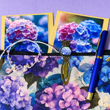 dark floral hydrangea gift set with textured large canvas pouch, owl hydrangea metal bookmark, crystal adjustable bracelet, blue metal pen and floral greetings cards with kraft envelopes. uk cute letterbox gifts shop. 