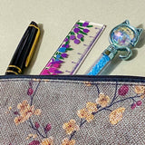 autumn hedgerow floral canvas pouch with taupe background, creamy flowers and burgundy rose hips, zip fastening and textured fabric. For journaling, pencil case or cosmetic bag. Uk gifts shop.