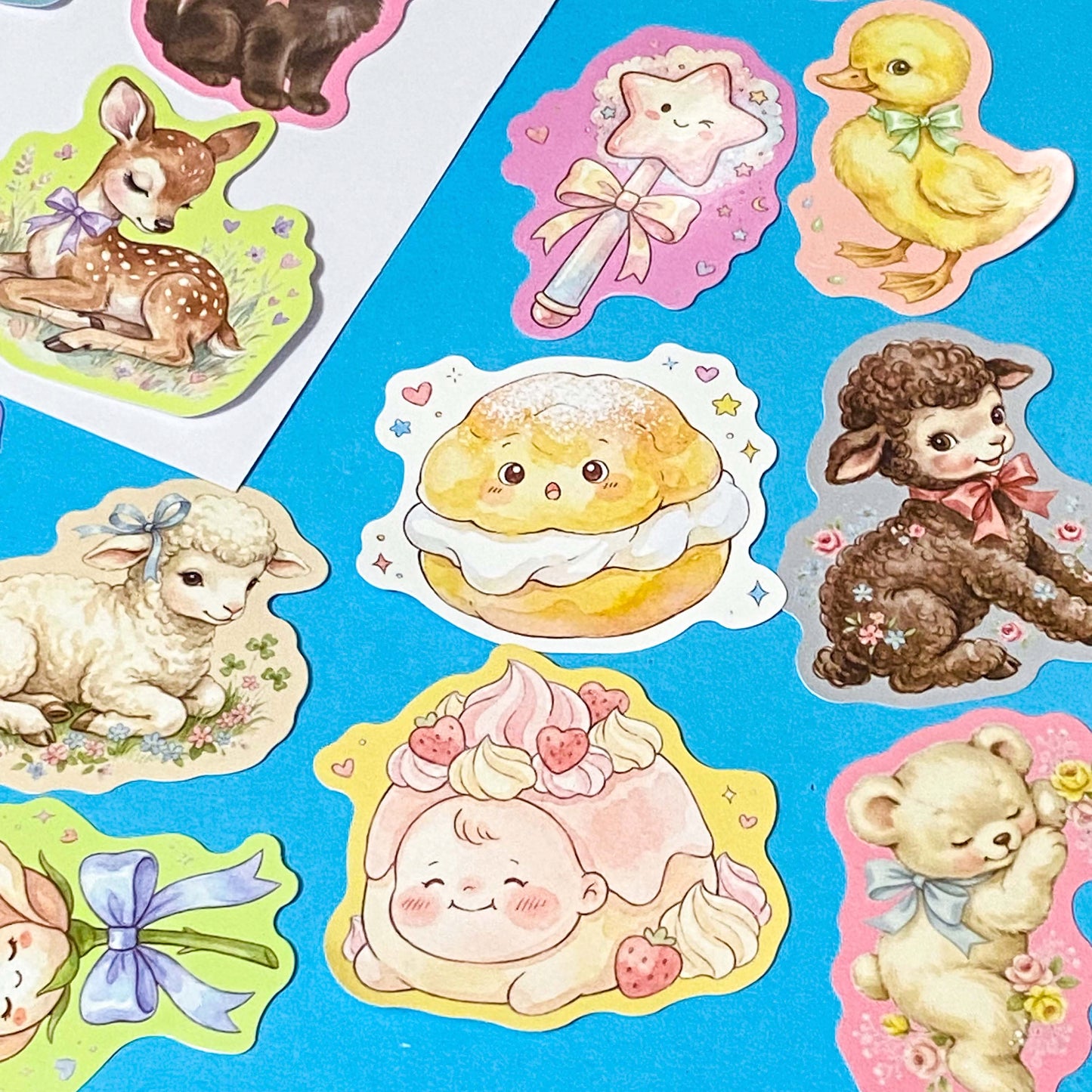 pack of 50 glossy pastel storybook stickers featuring baby animals, woodland creatures, sweet desserts and cakes, cosy drinks and whimsical kawaii illustrations, approx 53mm each. 