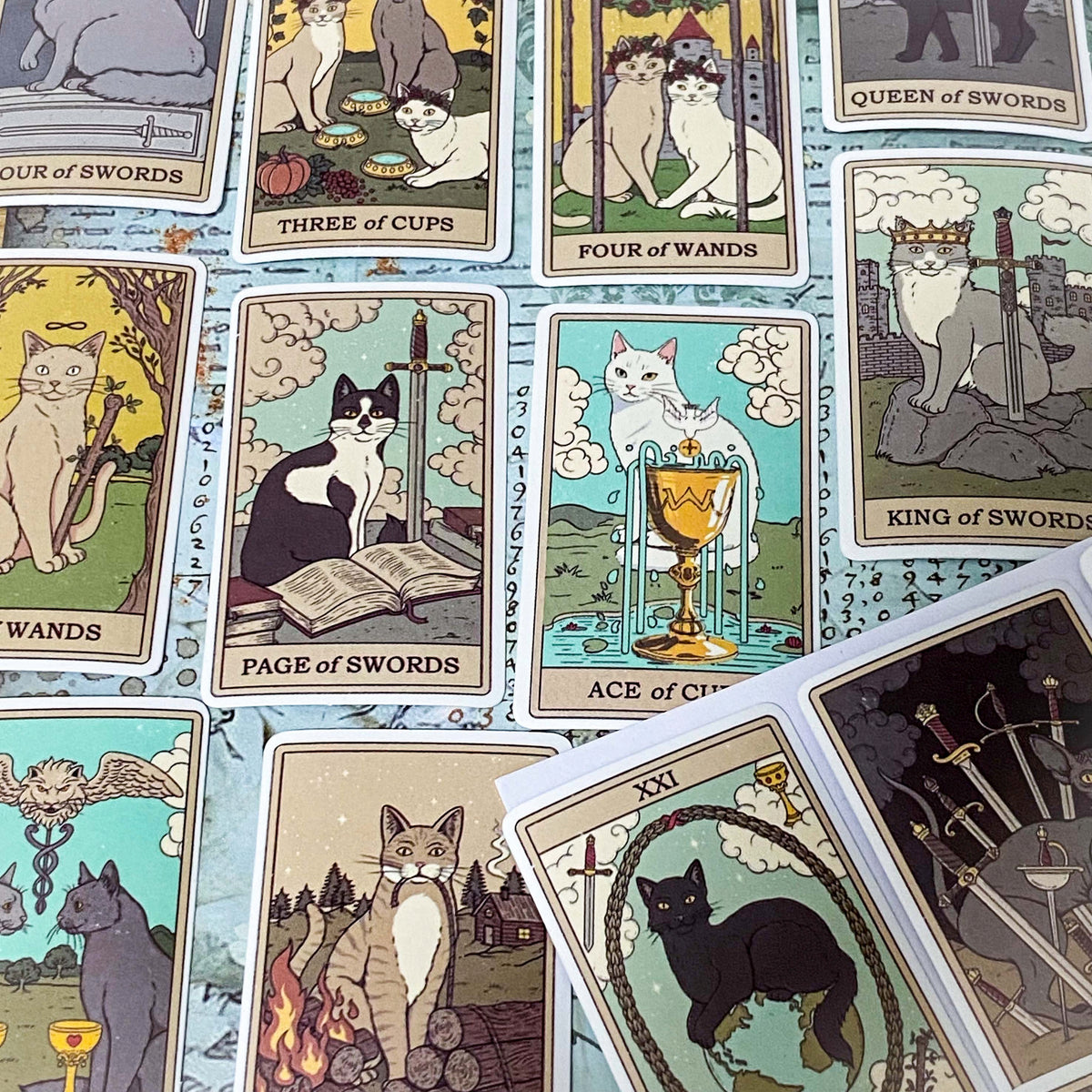 complete set of 78 cats tarot card stickers with matte finish and major and minor arcana including pentacles, swords, cups and wands and moon, emperor, death etc. uk mystical magical stationery gift.