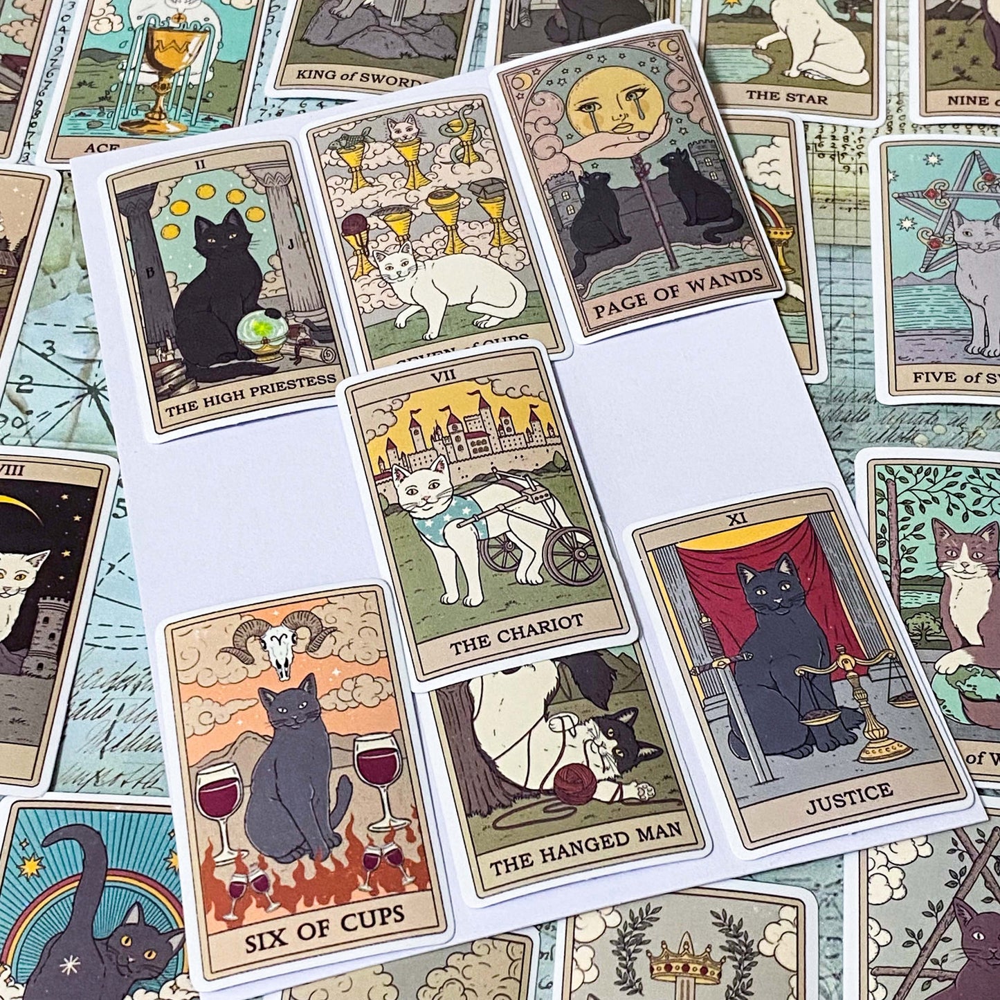 complete set of 78 cats tarot card stickers with matte finish and major and minor arcana including pentacles, swords, cups and wands and moon, emperor, death etc. uk mystical magical stationery gift.