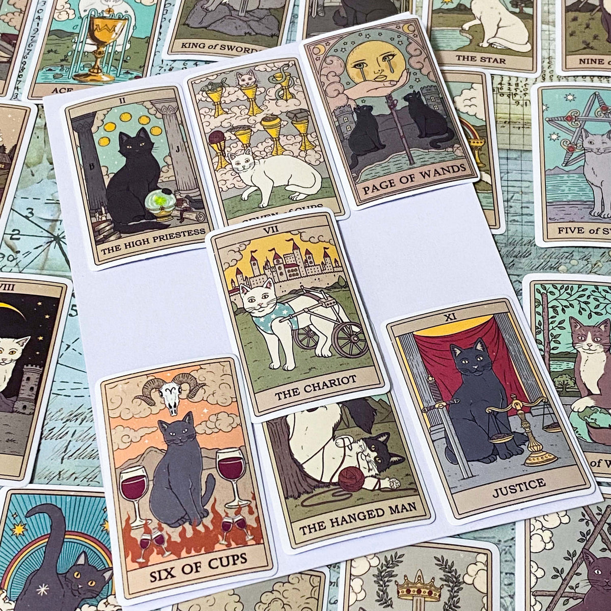 complete set of 78 cats tarot card stickers with matte finish and major and minor arcana including pentacles, swords, cups and wands and moon, emperor, death etc. uk mystical magical stationery gift.