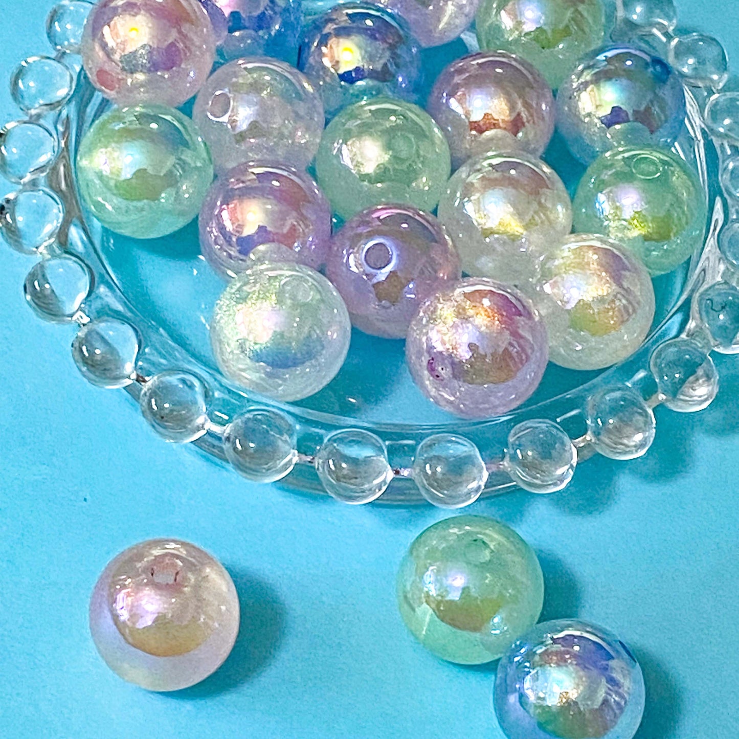 Iridescent large acrylic beads on a blue background