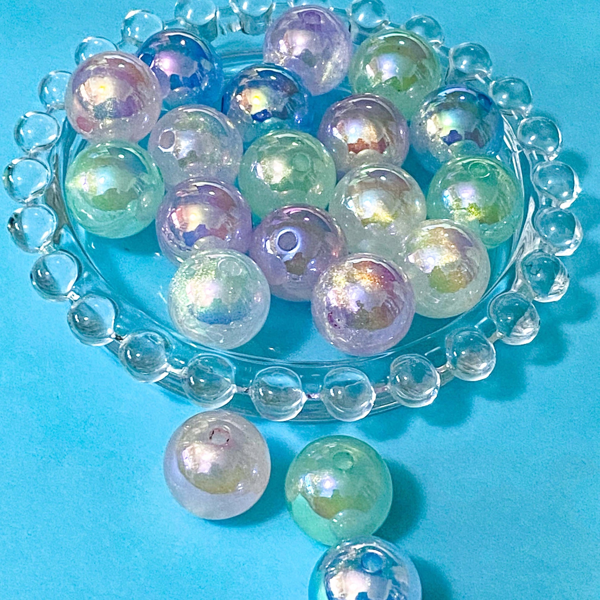 iridescent glow in the dark large round 15mm beads on a blue background