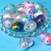 very large 22mm iridescent acrylic heart shaped beads on a blue background