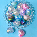 very large iridescent acrylic heart beads on a blue background