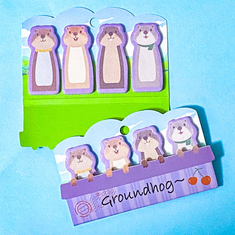 groundhog sticky index tab notes pad on a blue background