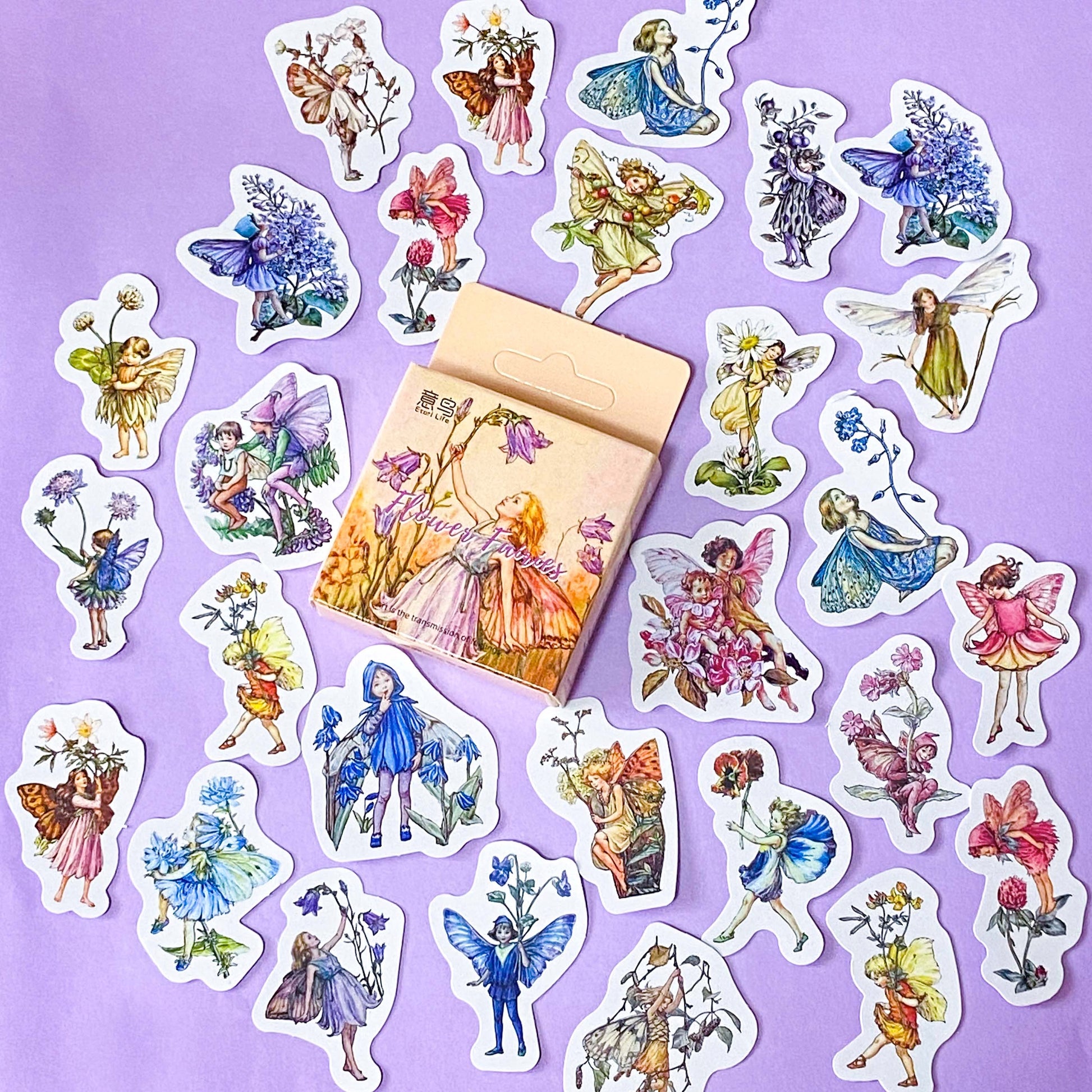 vintage flower fairy sticker box of 46 mini fairies stickers with floral decorations on a lilac background