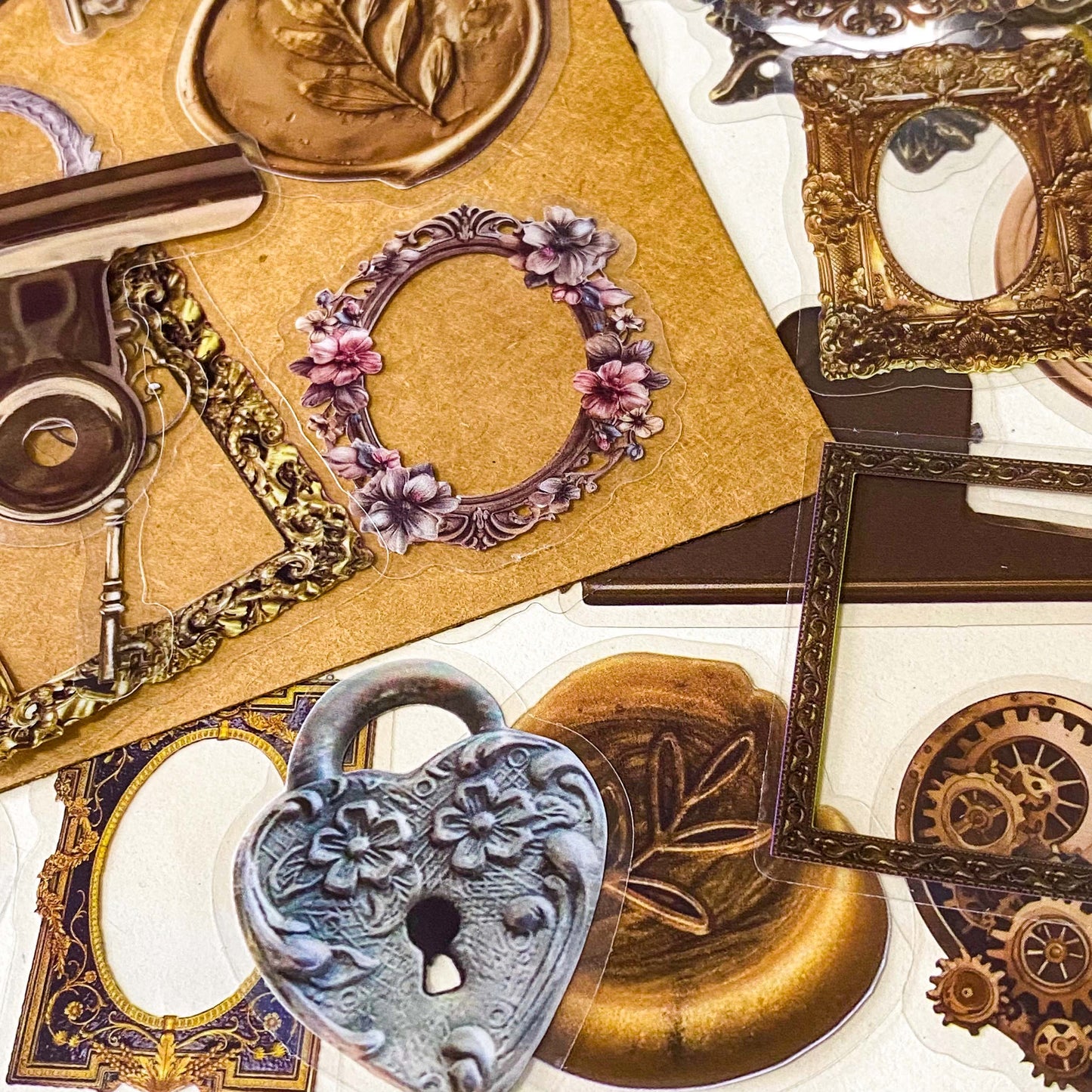 set of 68 vintage style clear PET stickers featuring ornate frames, antique keys, wax seals and clockwork designs in warm sepia tones on layered backing sheets