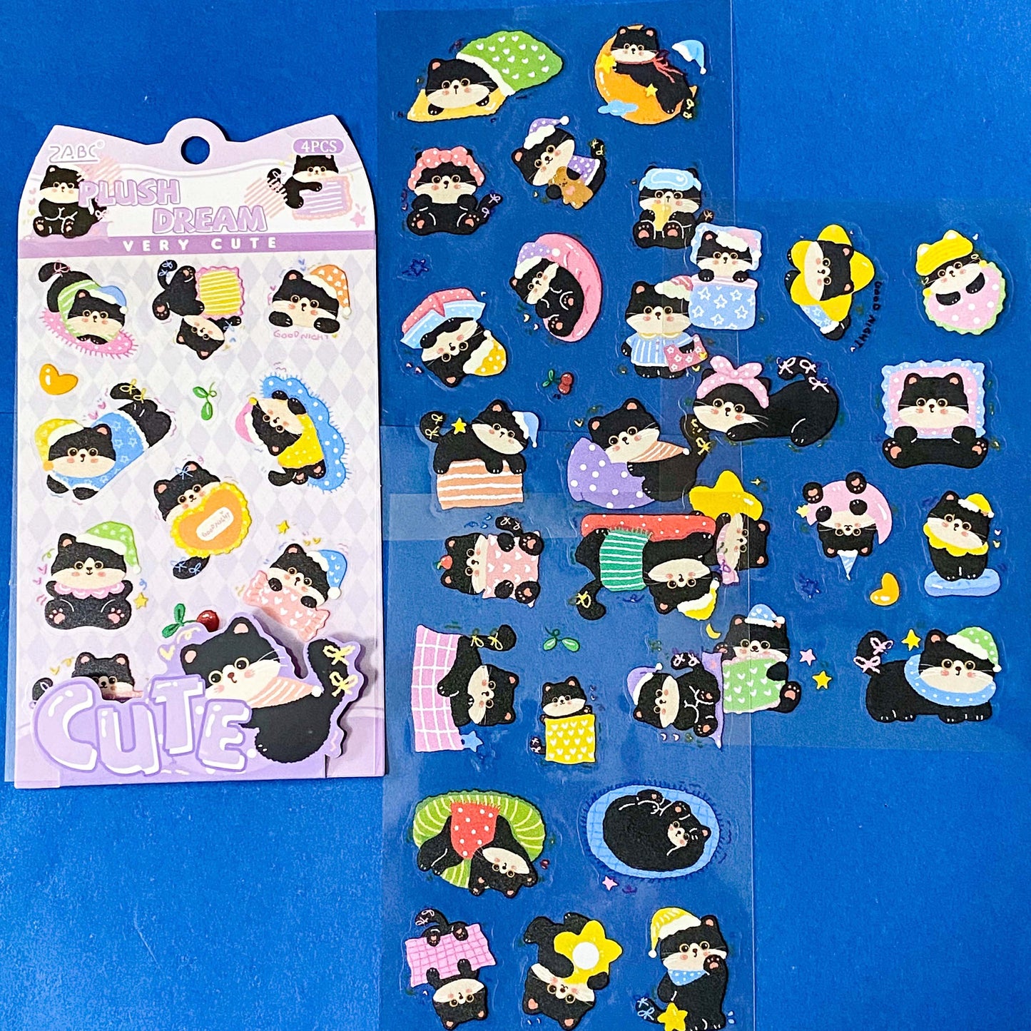 tuxedo black and white cat kawaii cartoon cats matte PET sticker packs of 4 sheets with colourful cute designs including summer holiday, christmas, party and fruits. uk stationery shop.