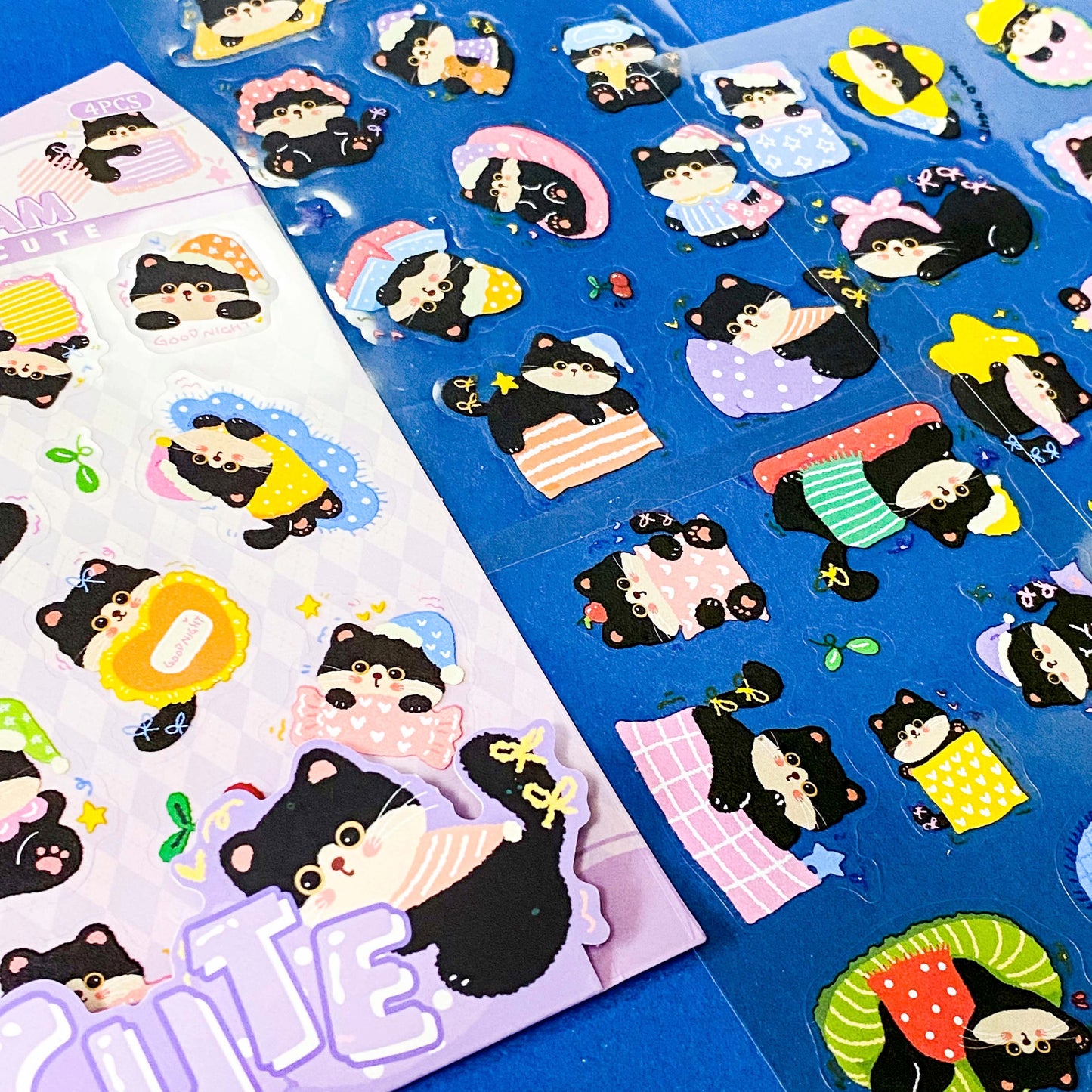 tuxedo black and white cat kawaii cartoon cats matte PET sticker packs of 4 sheets with colourful cute designs including summer holiday, christmas, party and fruits. uk stationery shop.