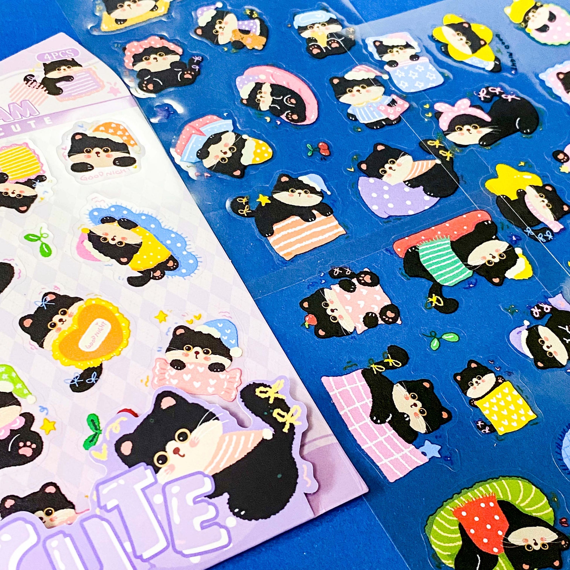tuxedo black and white cat kawaii cartoon cats matte PET sticker packs of 4 sheets with colourful cute designs including summer holiday, christmas, party and fruits. uk stationery shop.
