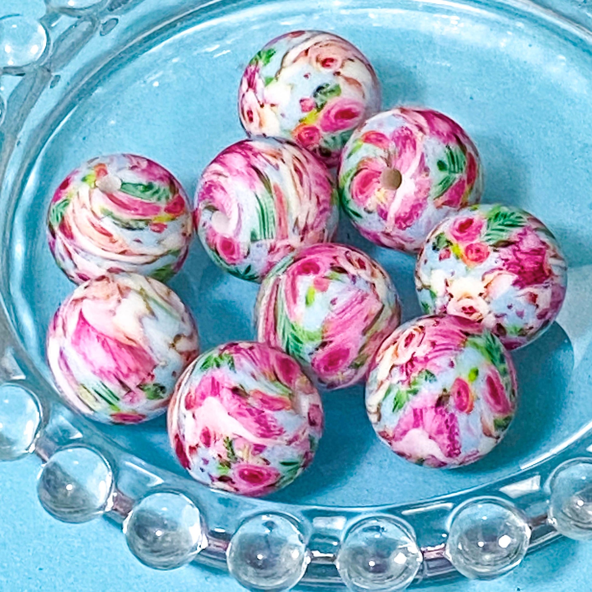 shabby chic vintage floral pink silicone beads on a blue background