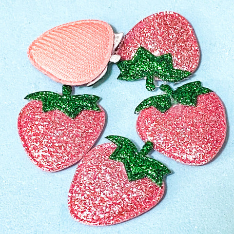 glitter pink strawberry applique patches on a blue background