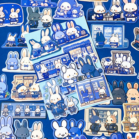 cosy blue bunny laptop sticker pack of 48 matte stickers on a dark blue background