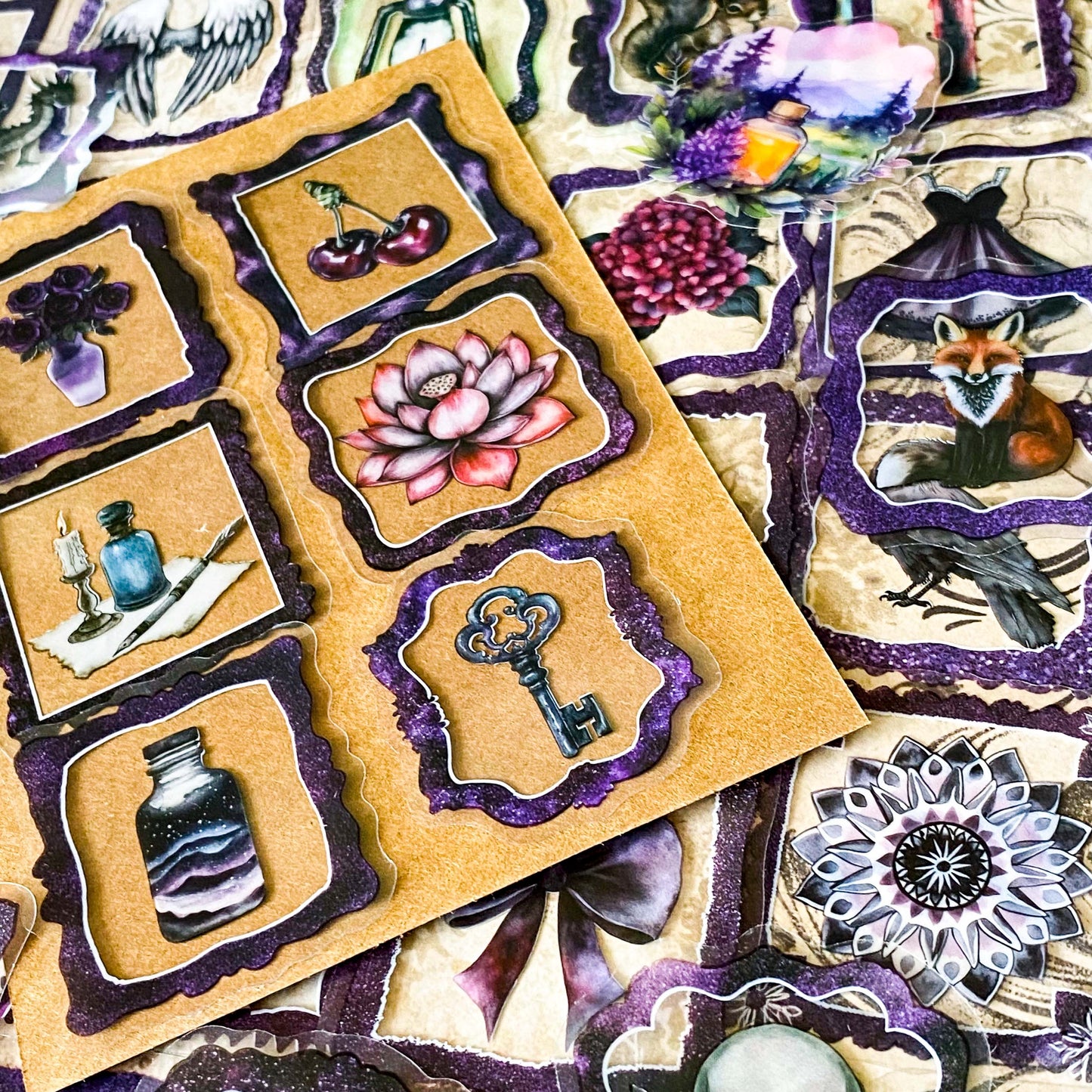 set of 50 gothic vintage plastic stickers with black and deep purple ornate frames featuring botanical illustrations, animals, victorian objects and curiosity cabinet themed designs