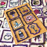 set of 50 gothic vintage plastic stickers with black and deep purple ornate frames featuring botanical illustrations, animals, victorian objects and curiosity cabinet themed designs