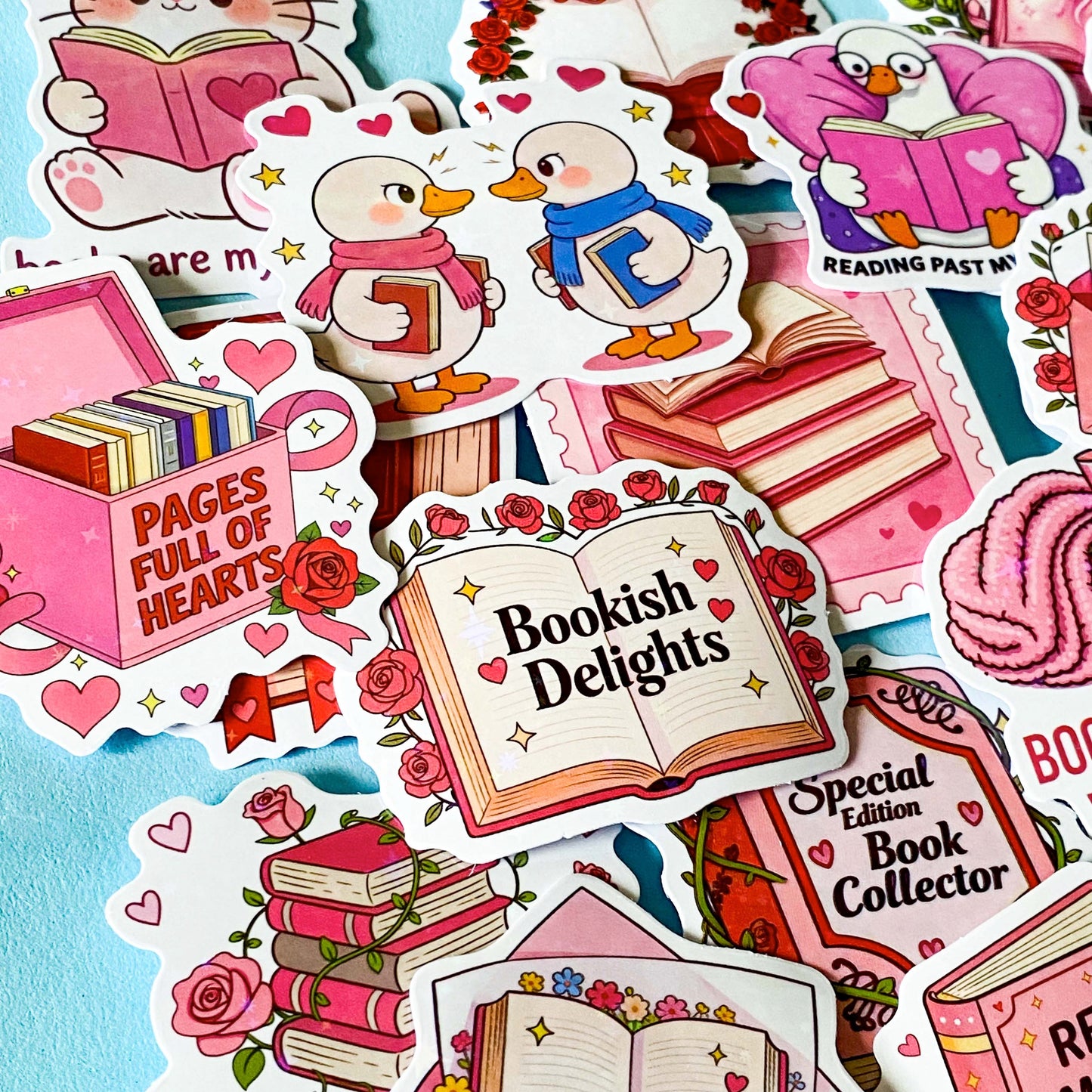 set of 52 stickers, book themed holographic stickers with pink and red designs featuring books, reading, animals , flowers and romantic bookish quotes 