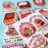 set of 52 stickers, book themed holographic stickers with pink and red designs featuring books, reading, animals , flowers and romantic bookish quotes 
