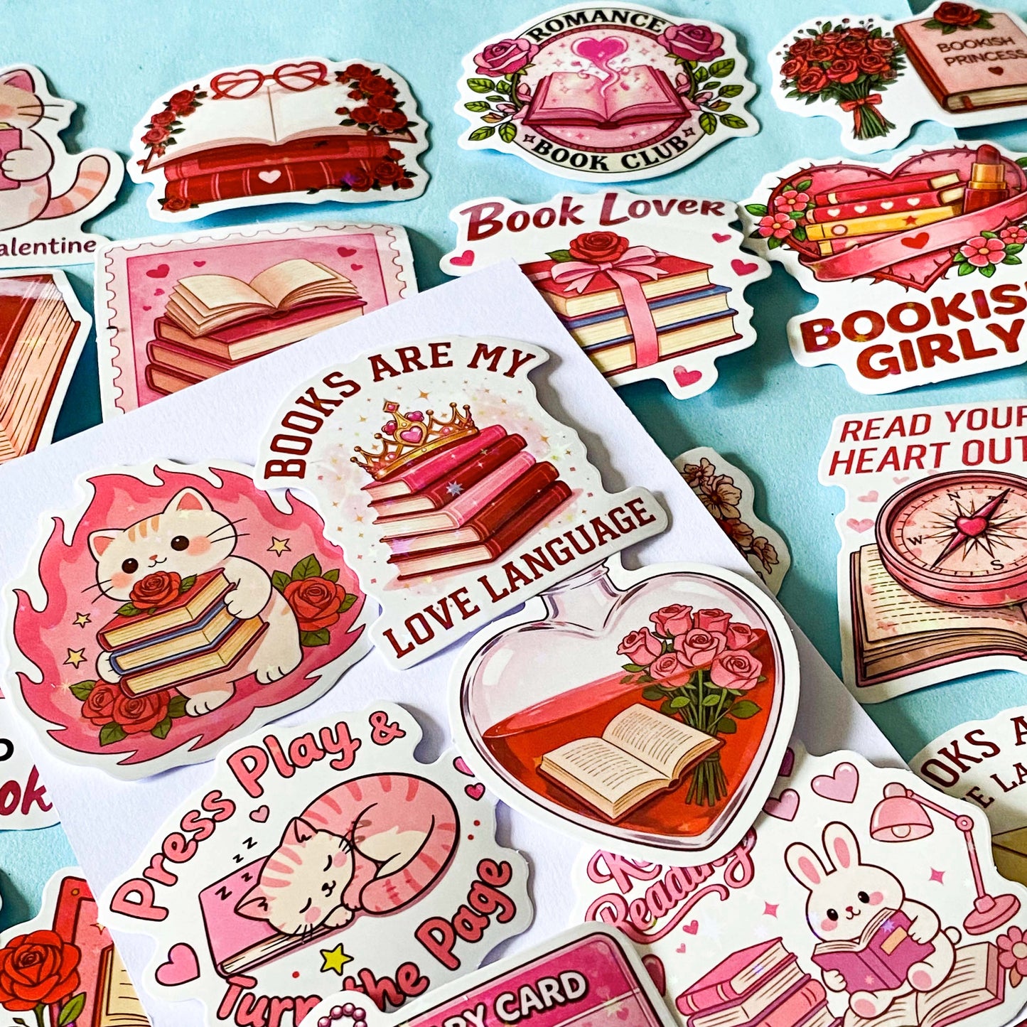 set of 52 stickers, book themed holographic stickers with pink and red designs featuring books, reading, animals , flowers and romantic bookish quotes 