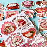 set of 52 stickers, book themed holographic stickers with pink and red designs featuring books, reading, animals , flowers and romantic bookish quotes 