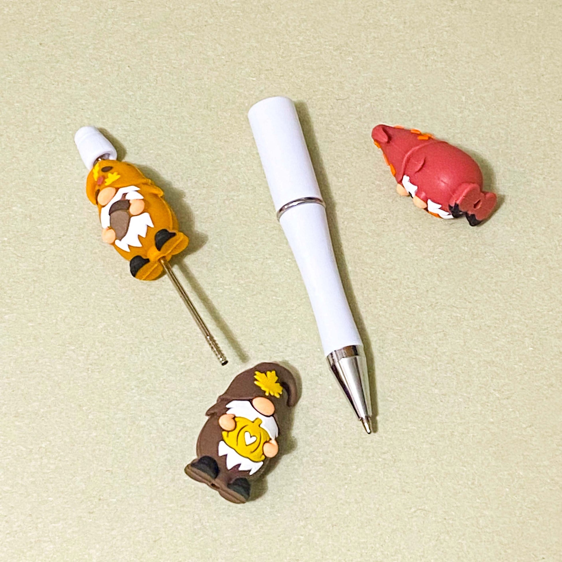 autumn cosy gnome silicone jumbo chunky bead with large hole for beaded pen making. orange, dark red and brown. hearts, coffee cup, pumpkins,  leaves and acorns. uk cute crafts supplies shop.