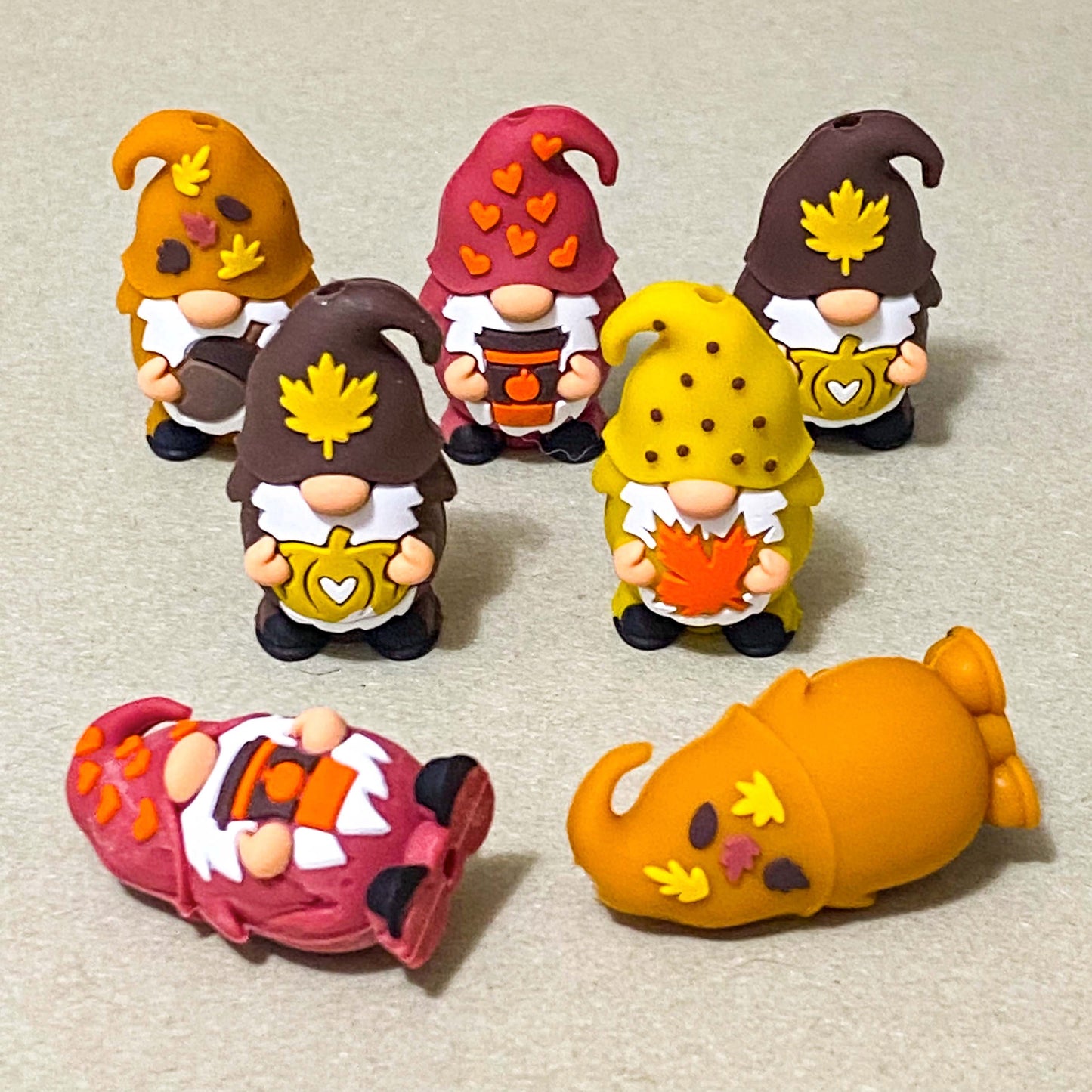 autumn cosy gnome silicone jumbo chunky bead with large hole for beaded pen making. orange, dark red and brown. hearts, coffee cup, pumpkins,  leaves and acorns. uk cute crafts supplies shop.
