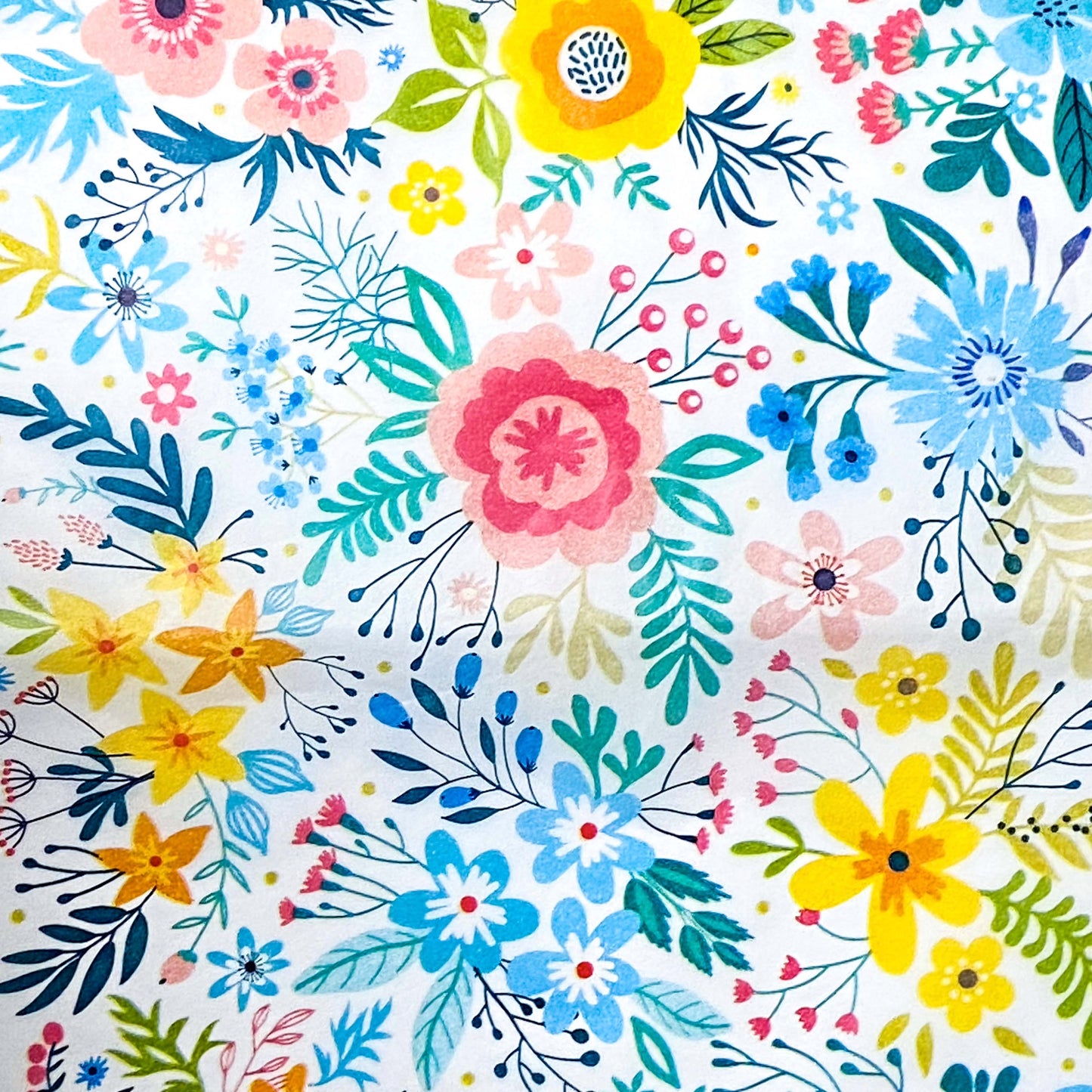 Colourful floral pattern tissue paper on a white background