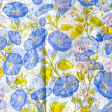 tissue paper pattern with blue flowers, yellow leaves, and small bears on a white background