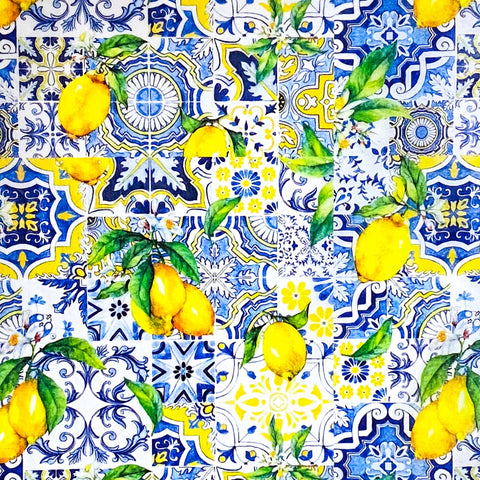 tissue paper with a pattern of lemons and blue and white tiles with floral designs.