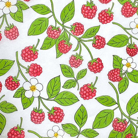 tissue paper with a red raspberries white flowers and green leaves pattern on a white background