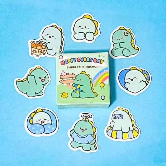 set of cute green dinosaur sticker flakes with a mini box on a blue background