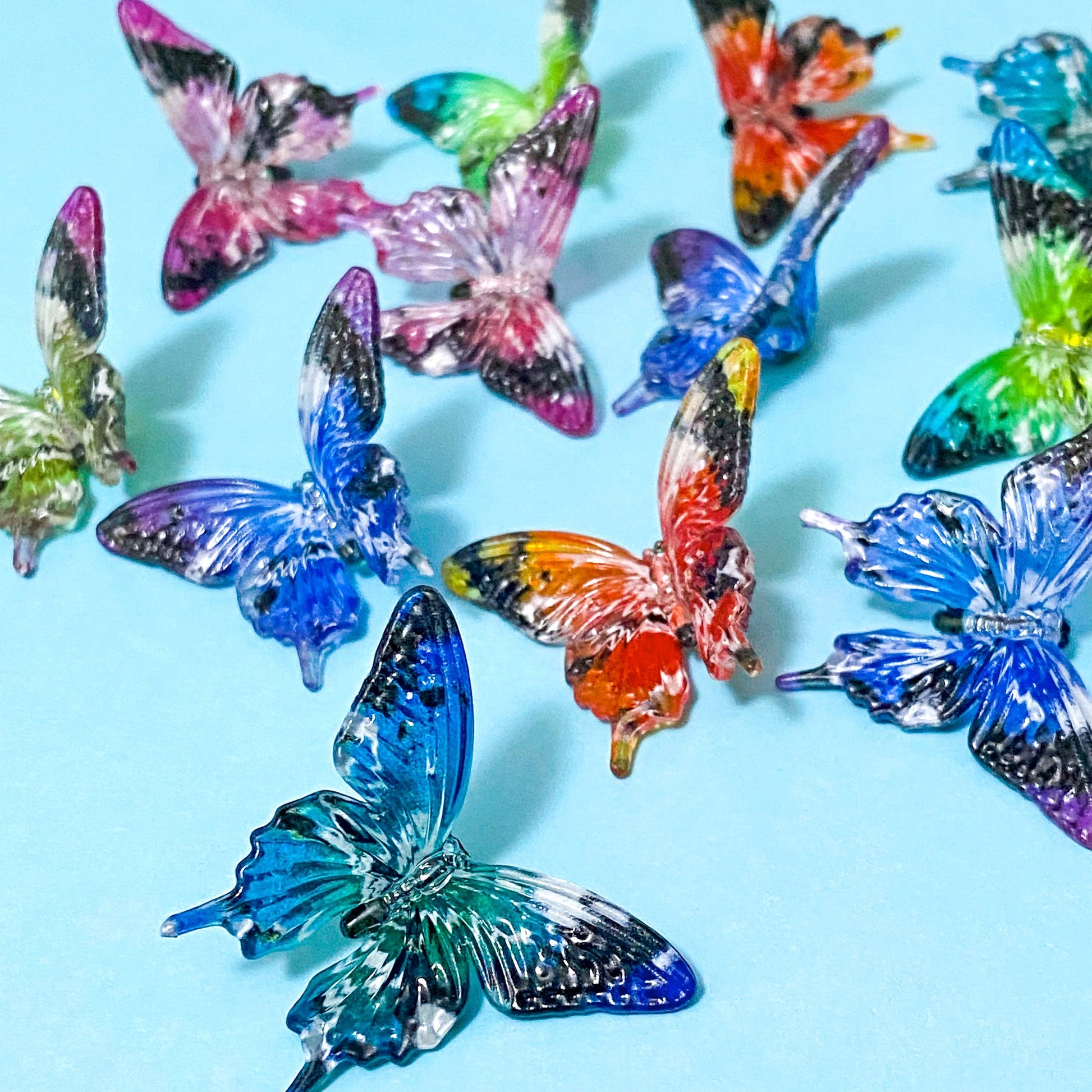 very large acrylic butterfly beads on a blue background