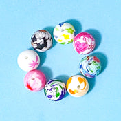 silicone floral 16mm round beads on a blue background