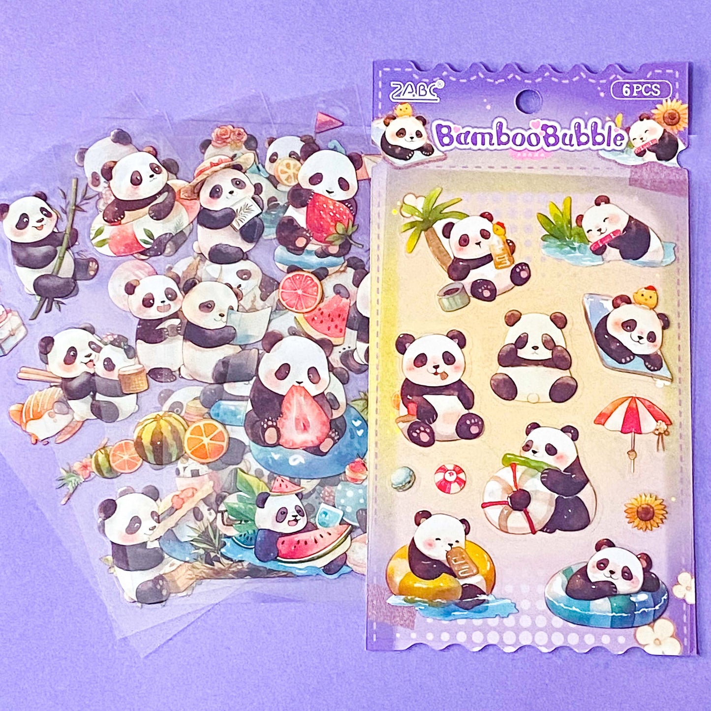 pack of 6 clear plastic stickers sheets of cute and kawaii pandas on a pale lilac background