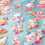 Collection of cute cat illustration clear plastic stickers on a blue background