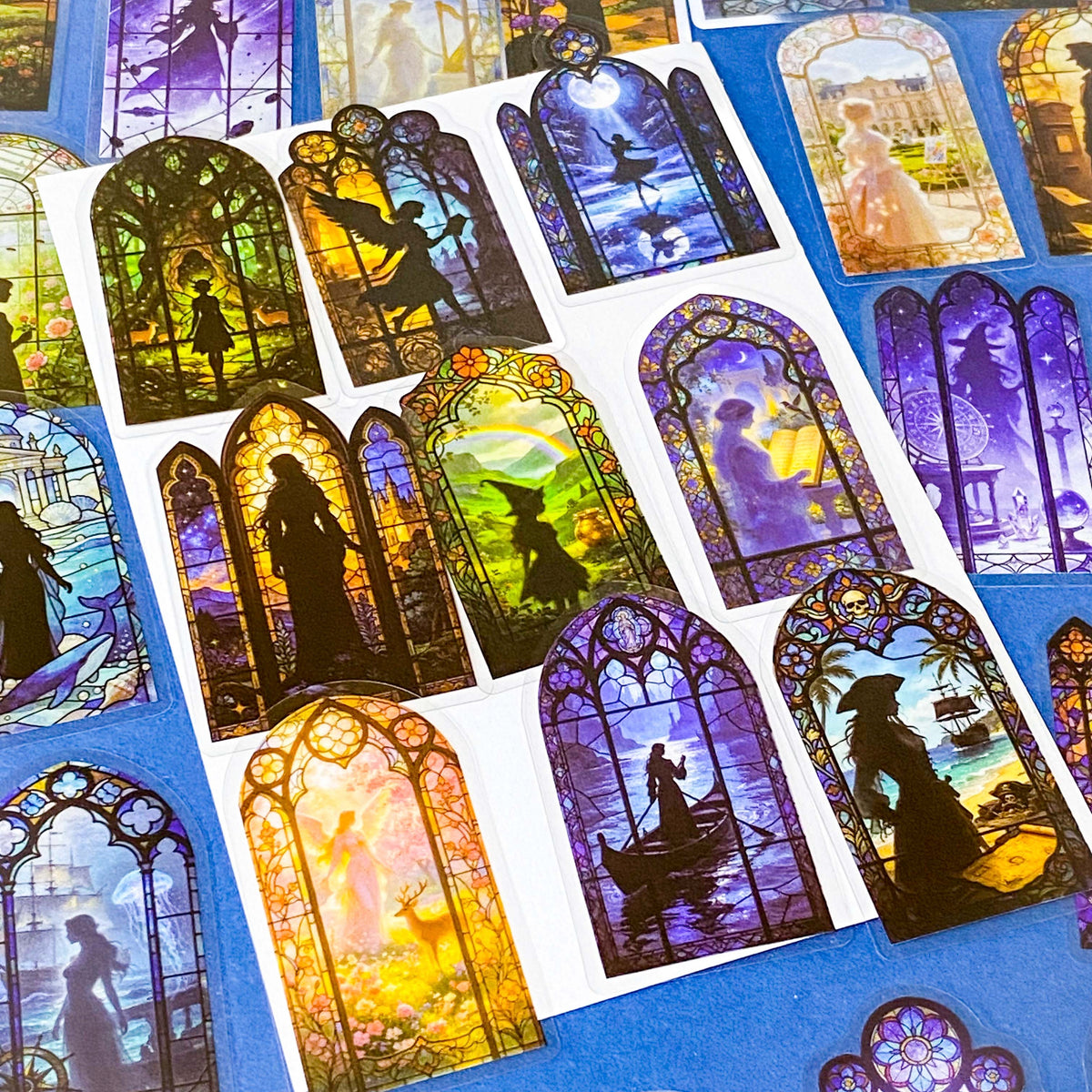 50 different storybook fairytale stained glass window stickers PET clear plastic. Scenes include fairies, witches, mermaids, castles, forests, pirates, enchanted  magical forests and oceans. uk sticker shop gift set.