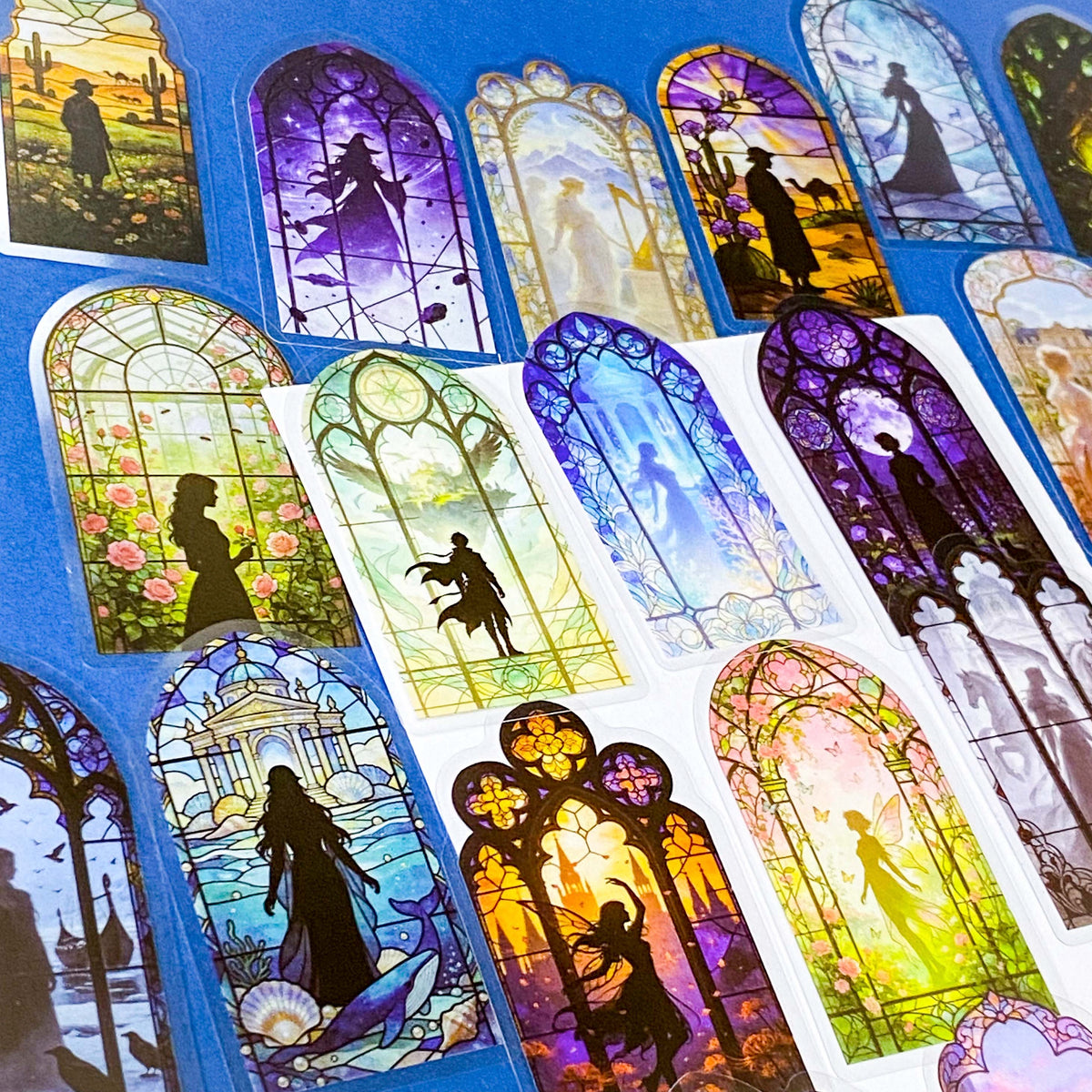 50 different storybook fairytale stained glass window stickers PET clear plastic. Scenes include fairies, witches, mermaids, castles, forests, pirates, enchanted  magical forests and oceans. uk sticker shop gift set.