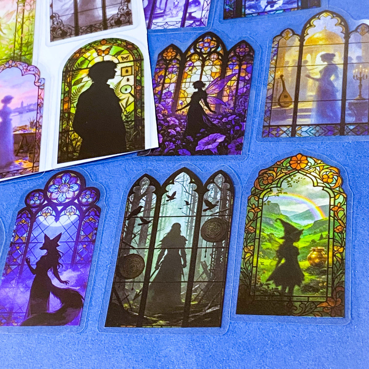 50 different storybook fairytale stained glass window stickers PET clear plastic. Scenes include fairies, witches, mermaids, castles, forests, pirates, enchanted  magical forests and oceans. uk sticker shop gift set.