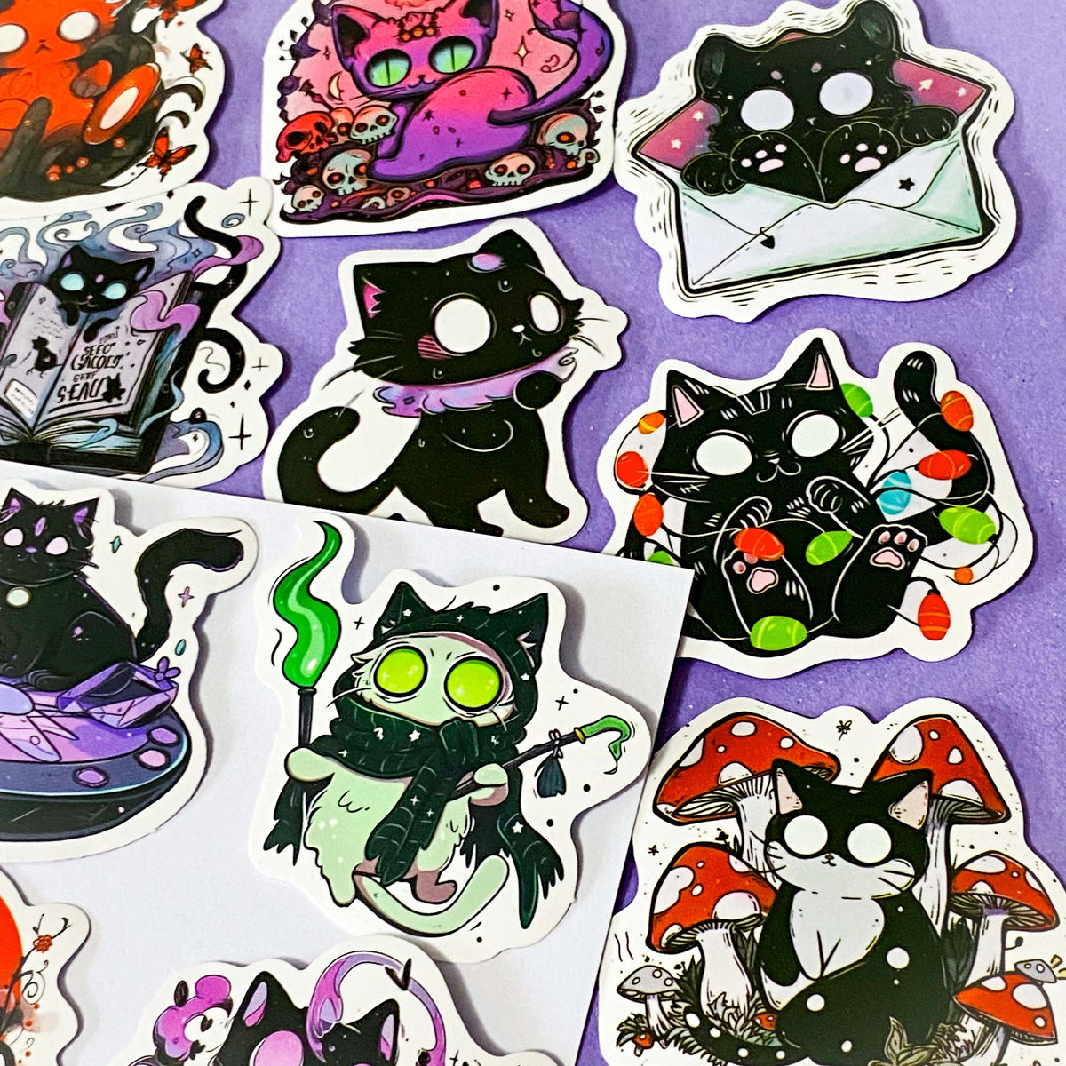 50 different kawaii matte paper cat stickers featuring magical black cats, witches, potions, mushrooms, moons, planets, strawberries, spell books, cute fantasy night time illustrations. uk sticker gift shop.