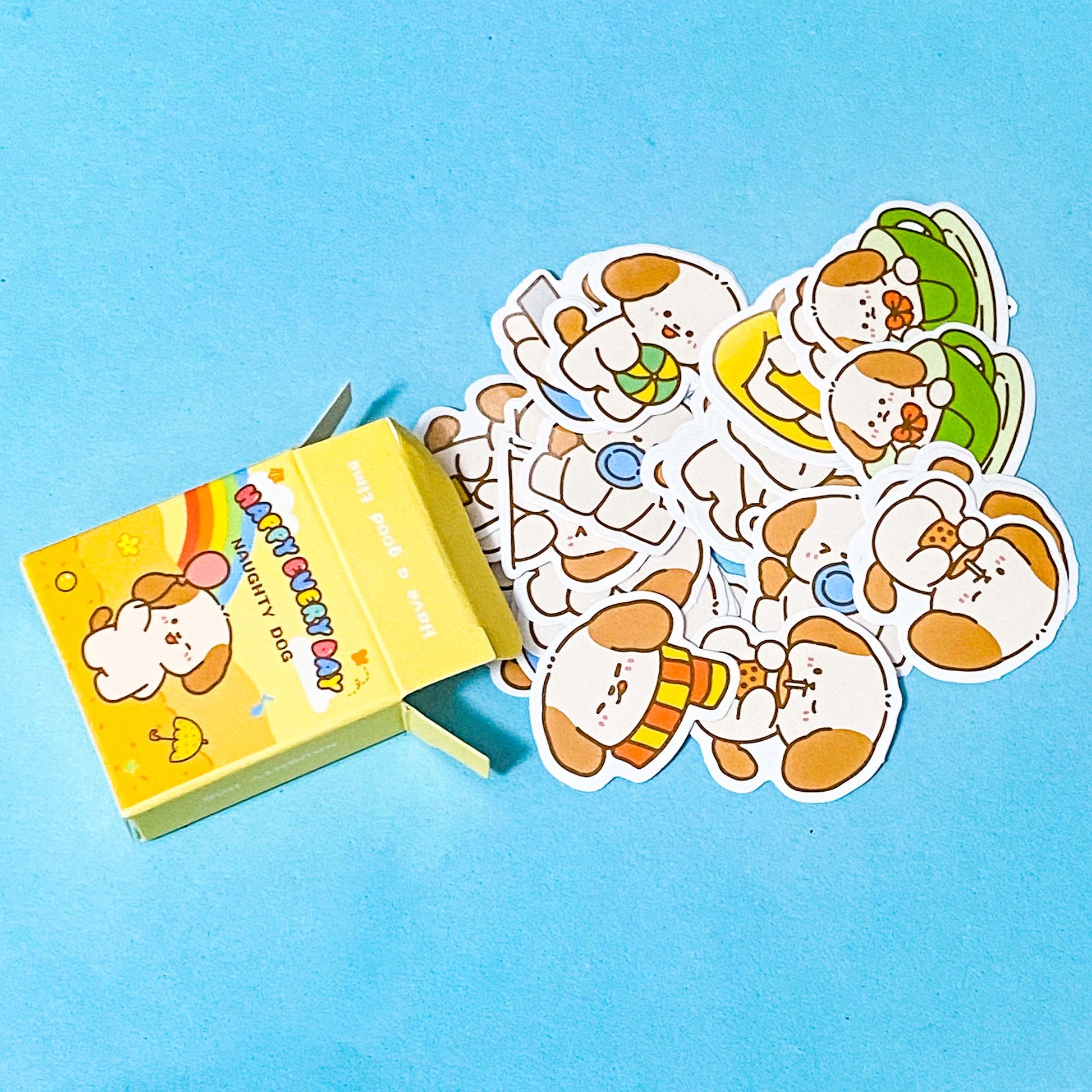 Set of cartoon dog stickers with a yellow box on a blue background